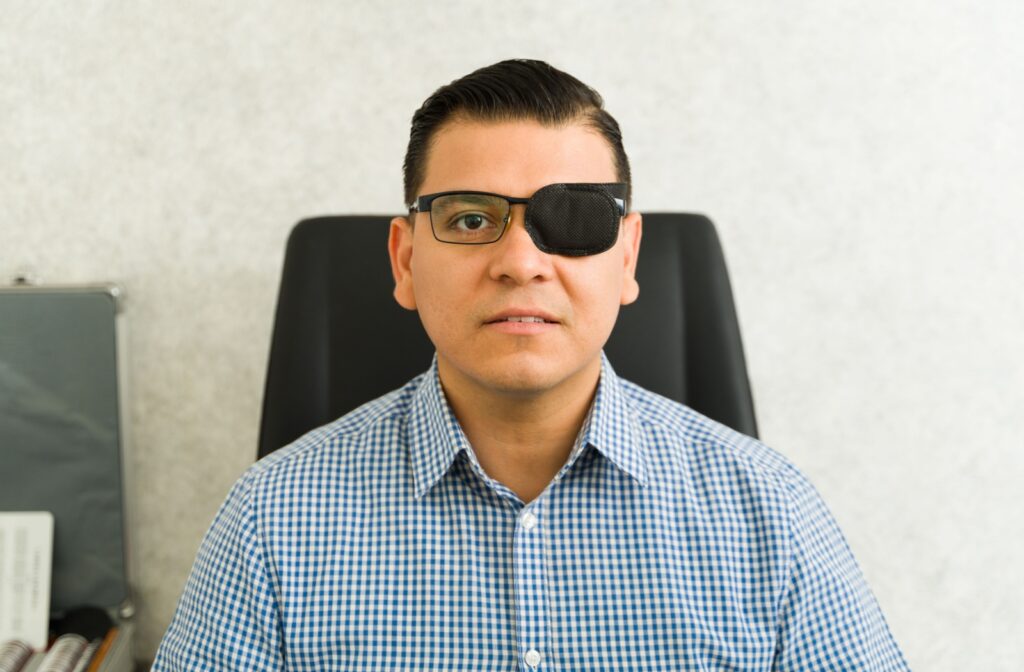 An adult wears an eye patch to treat lazy eye.