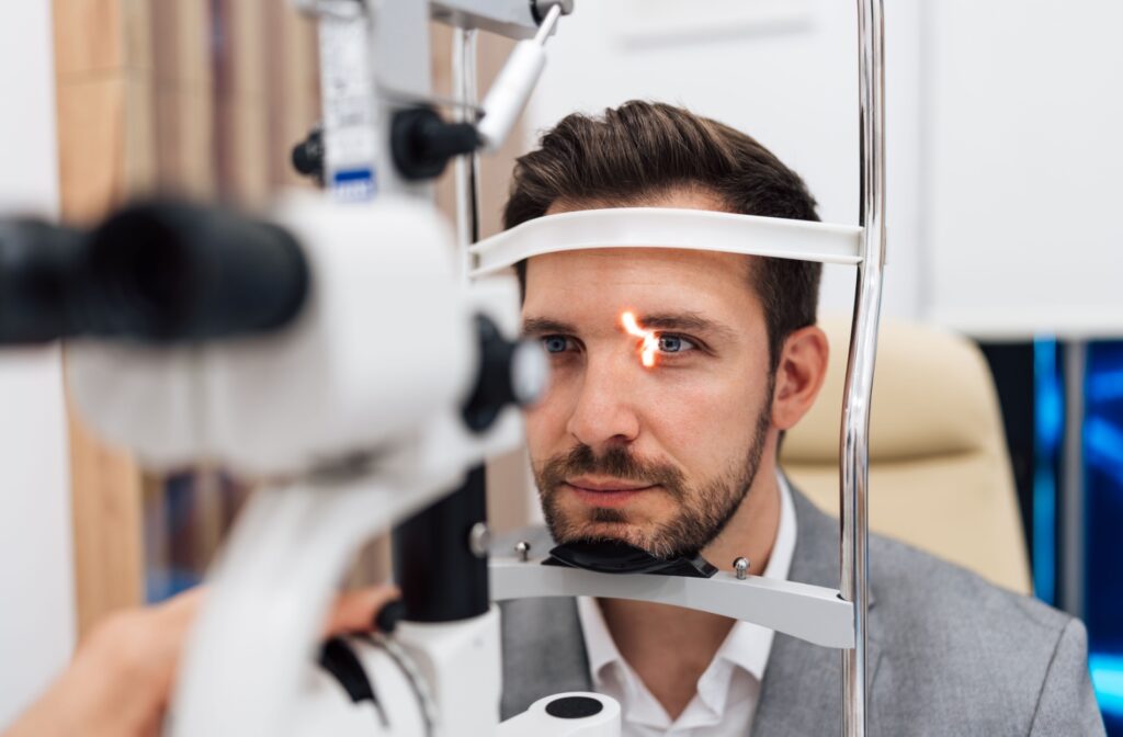 A man getting his eyes checked by an optometrist.