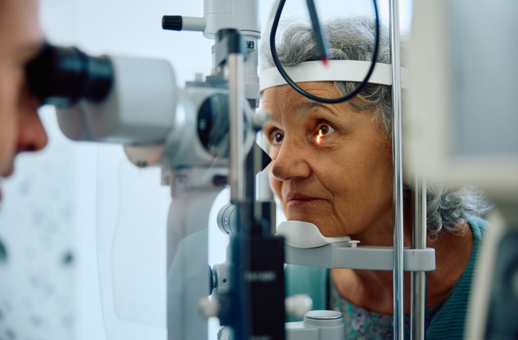 A person with diabetes has their eyes examined by an optometrist.